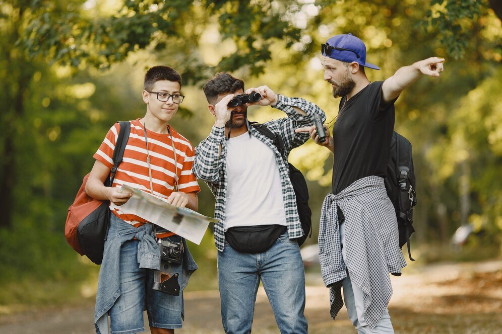 adventure hike people concept group smiling friends forest man with binoculars_1157 45174