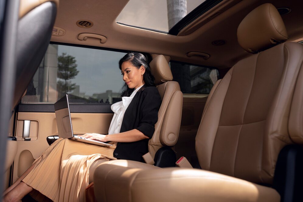 businesswoman sitting backseat taxi_23 2149236702