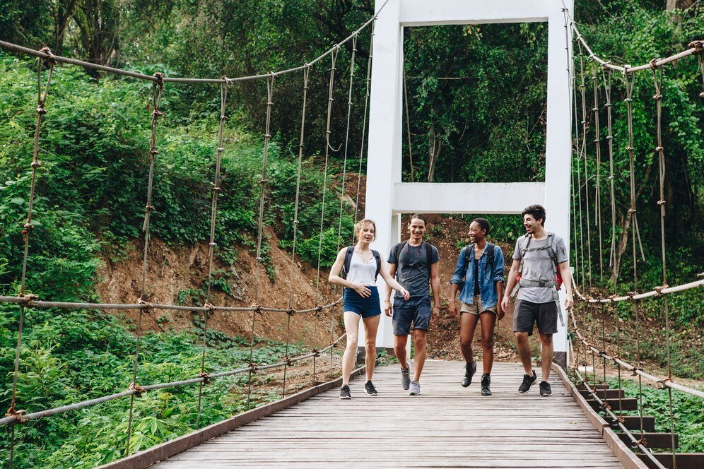 group friends walking bridge tropical countryside adventure journey concept_53876 30592